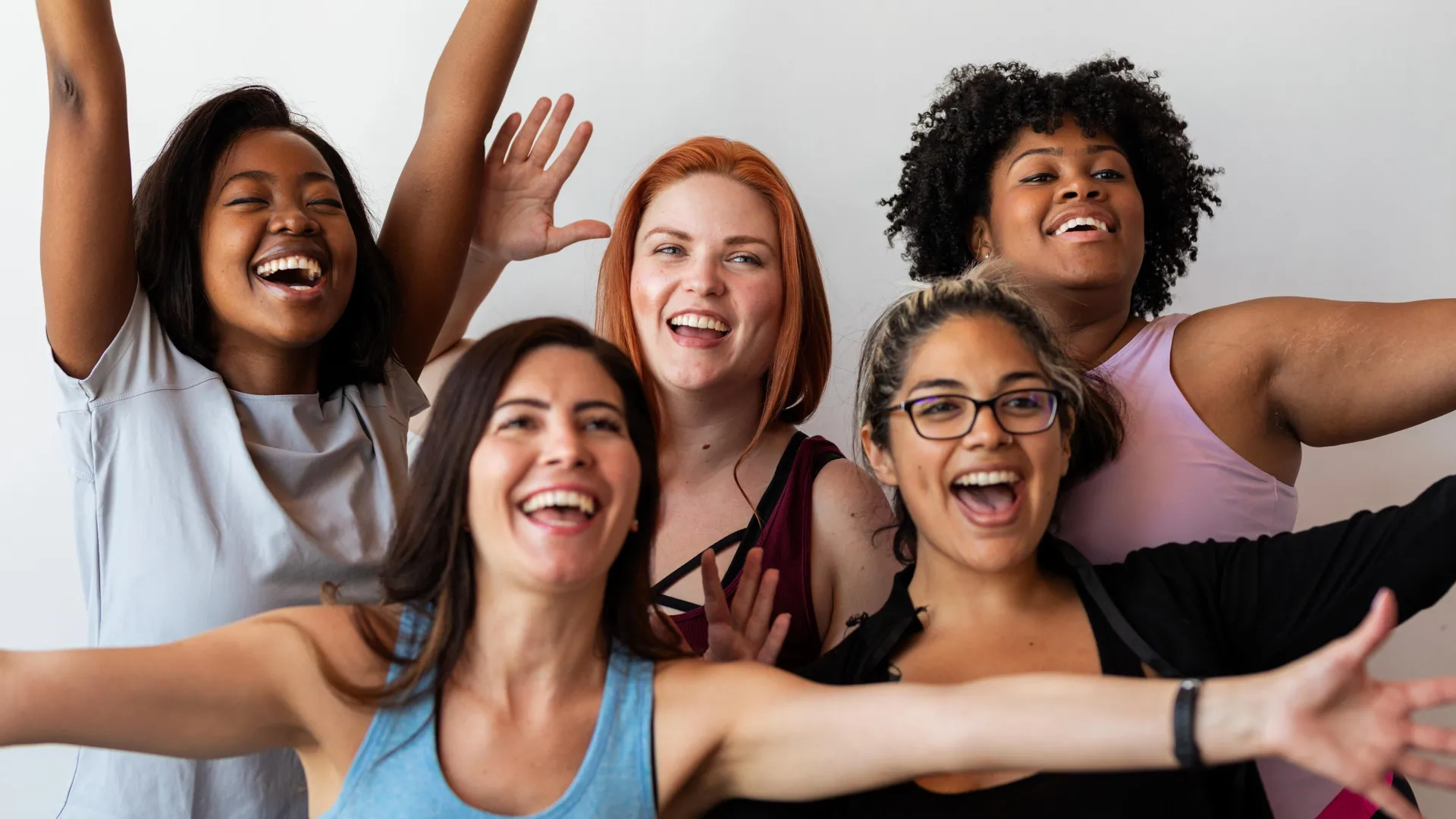 happy-fit-diverse-women-celebrating.webp